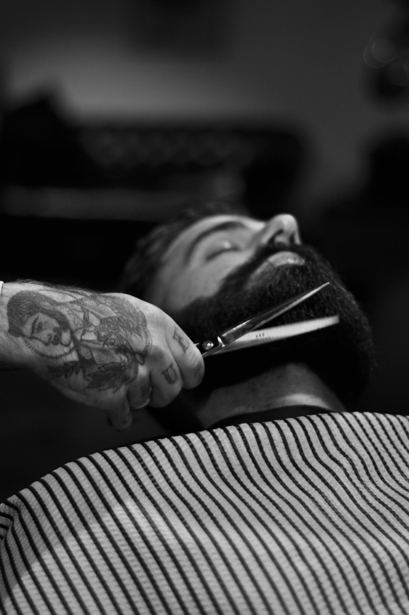 Scissors shaping a beard